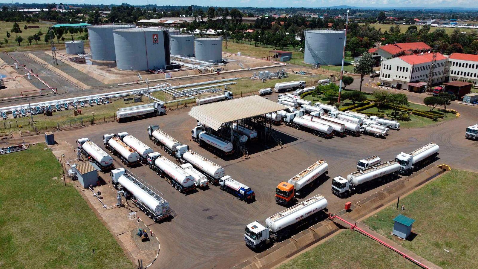 Petroleum tanker trucks transporting fuel along a highway in Kenya.