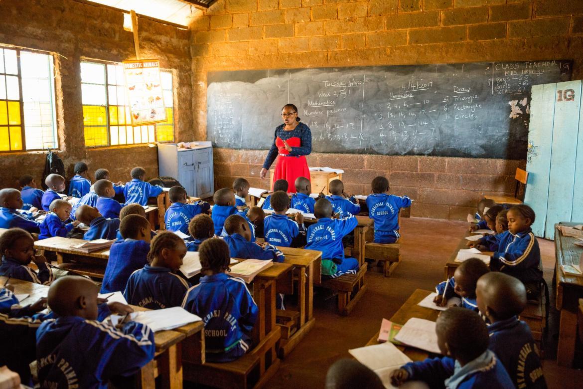 Kenyan teacher conducting a lesson in a classroom