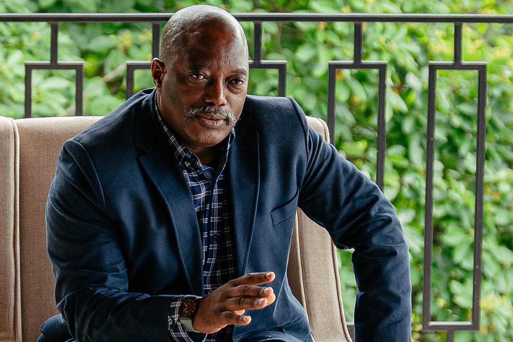 Former DR Congo President Joseph Kabila seated during an official meeting.