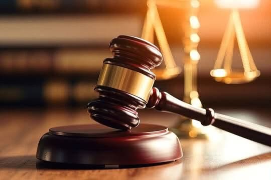 A judge's gavel and scales of justice representing the Malindi wildlife trophies case