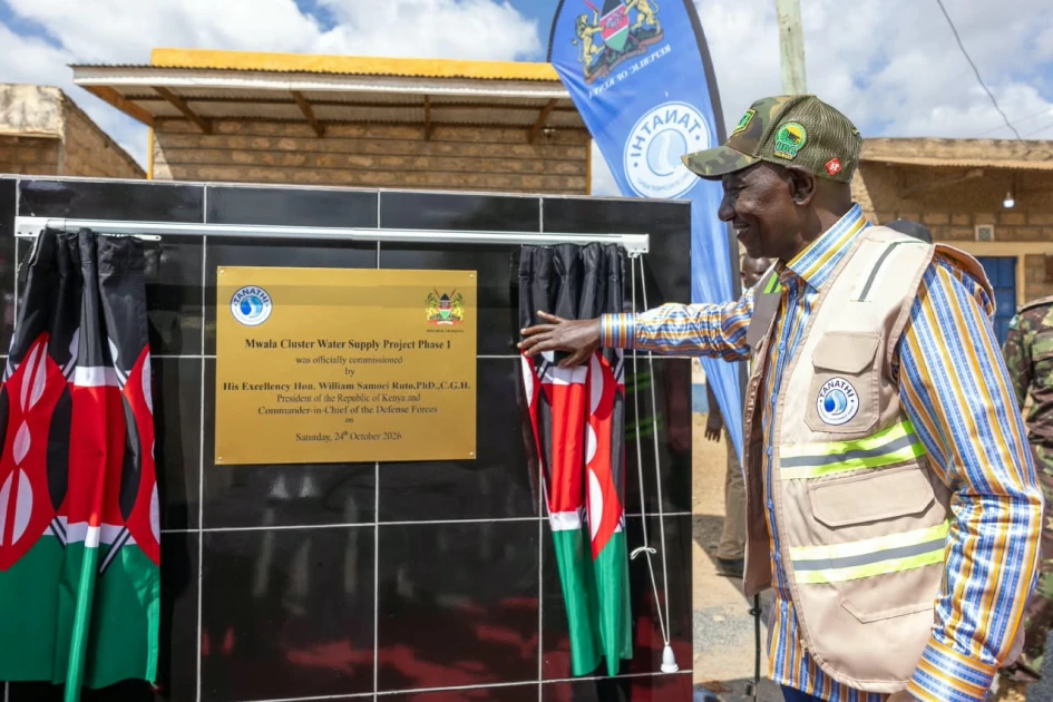 President William Ruto stands beside the commemorative plaque for the Mwala Cluster Water Supply Project during his Ukambani development tour