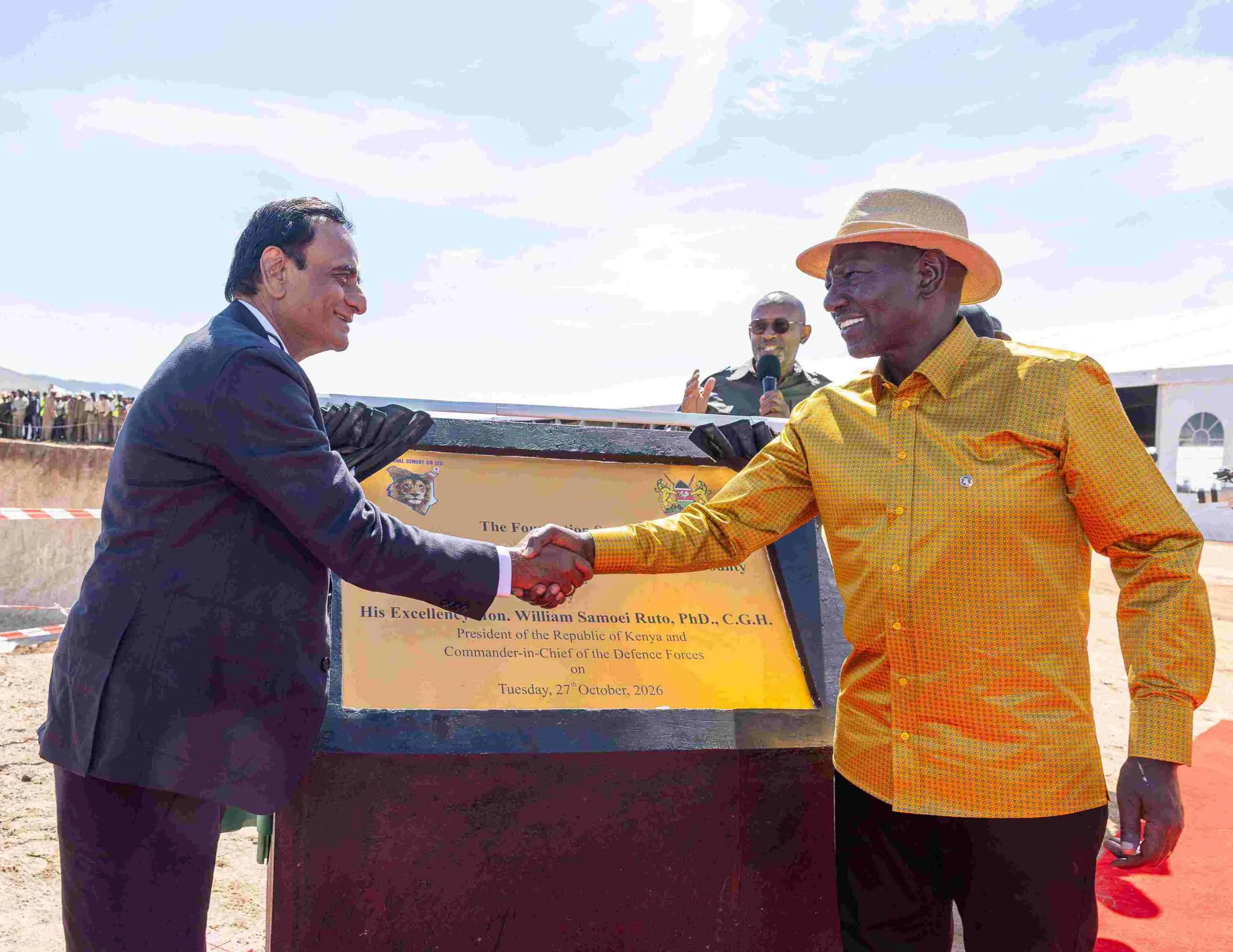 President William Ruto shakes hands with a Devki Group representative during the groundbreaking ceremony for a proposed cement plant in Kitui County.