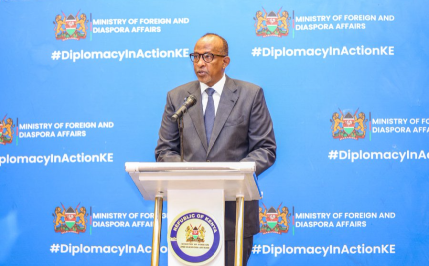 Kenyan government official speaking at a Ministry of Foreign and Diaspora Affairs podium.