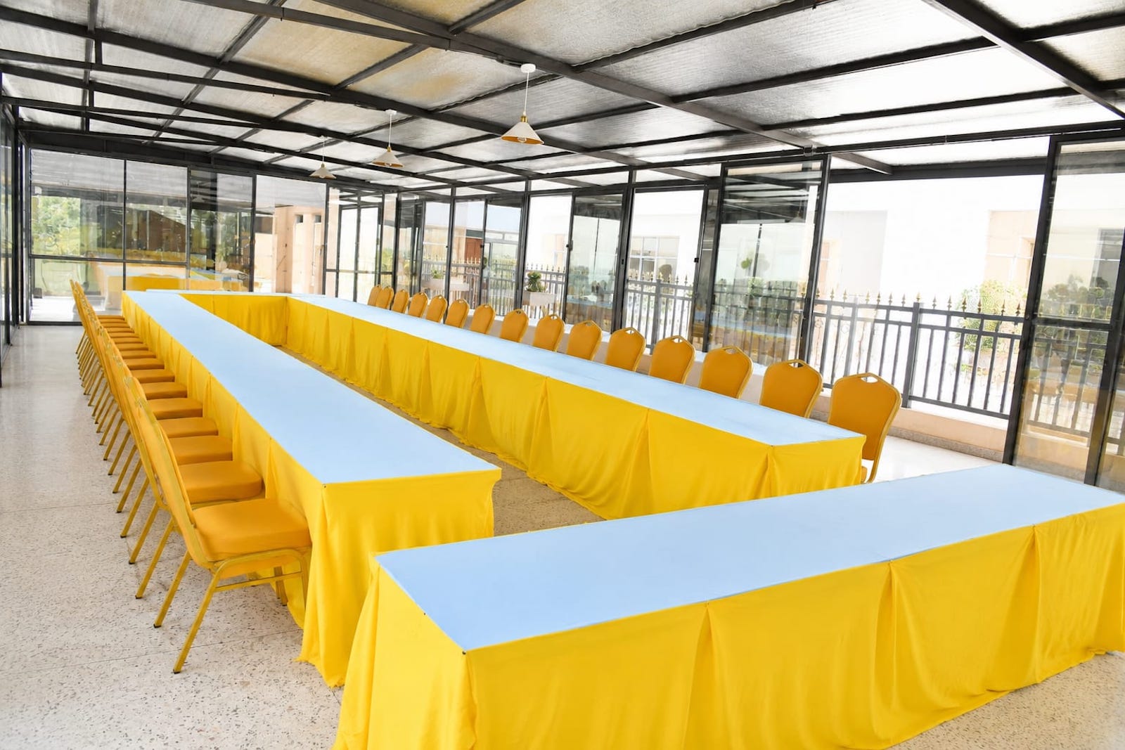 Conference room arranged with tables and chairs