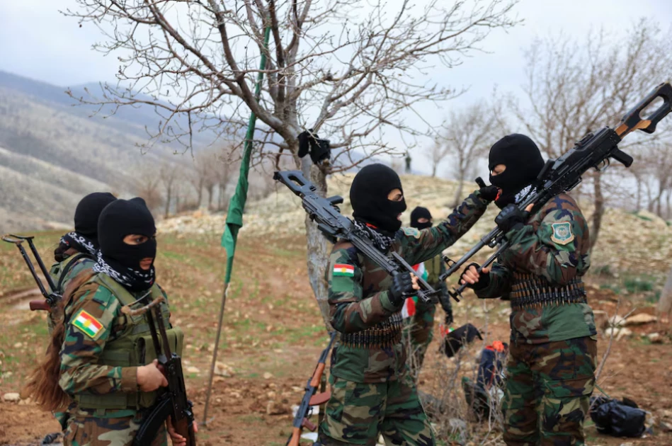 Iranian Kurdish fighters from the Kurdistan Freedom Party (PAK) take part in a training session at a base on the outskirts of Erbil, Iraq February 12, 2026. REUTERS/Thaier Al-Sudani/File Photo