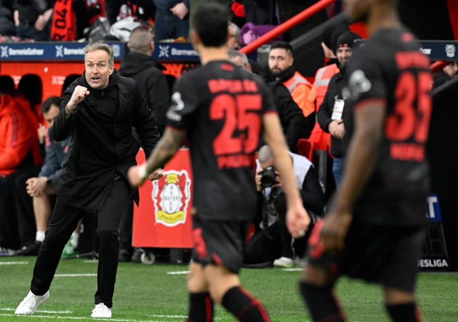 Bayern Munich players celebrate during a Bundesliga match against Bayer Leverkusen