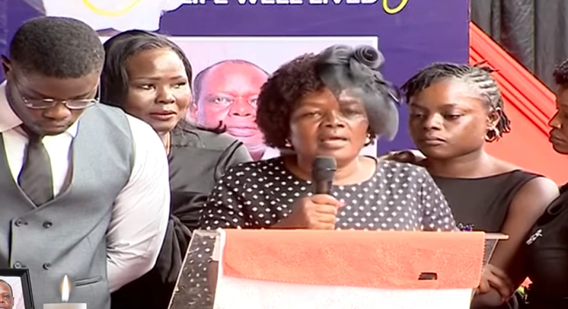 Mourners gather during the burial ceremony of helicopter pilot George Were in Nyakach.